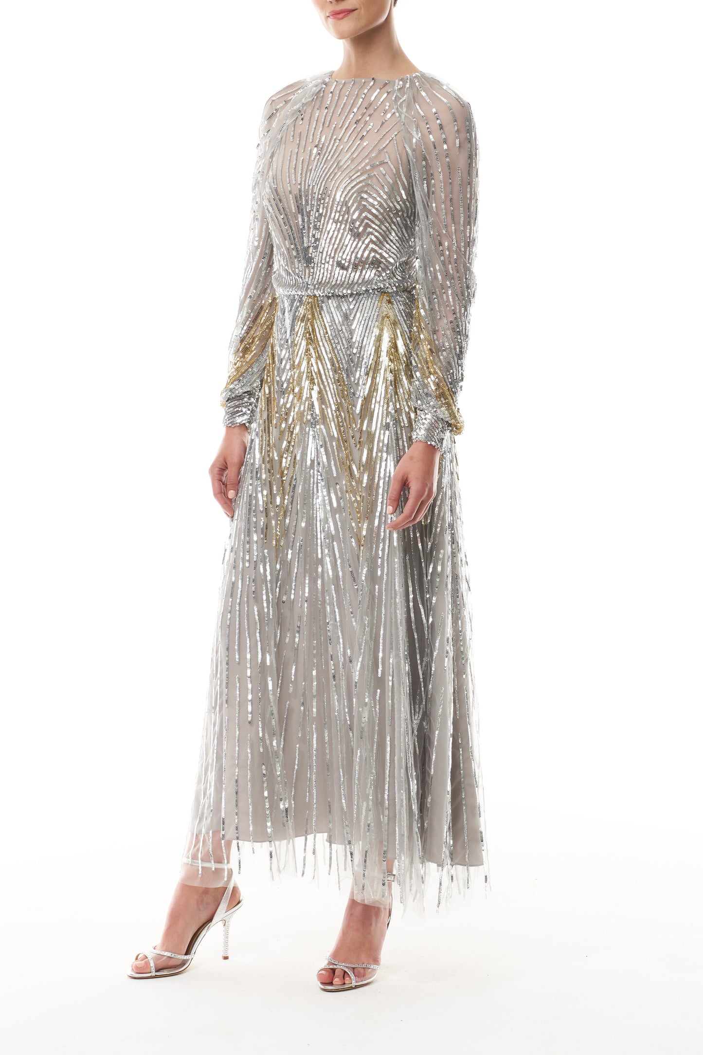 Long sleeve midi dress in silver & gold sequin embroidery with semi-sheer bodice - side.