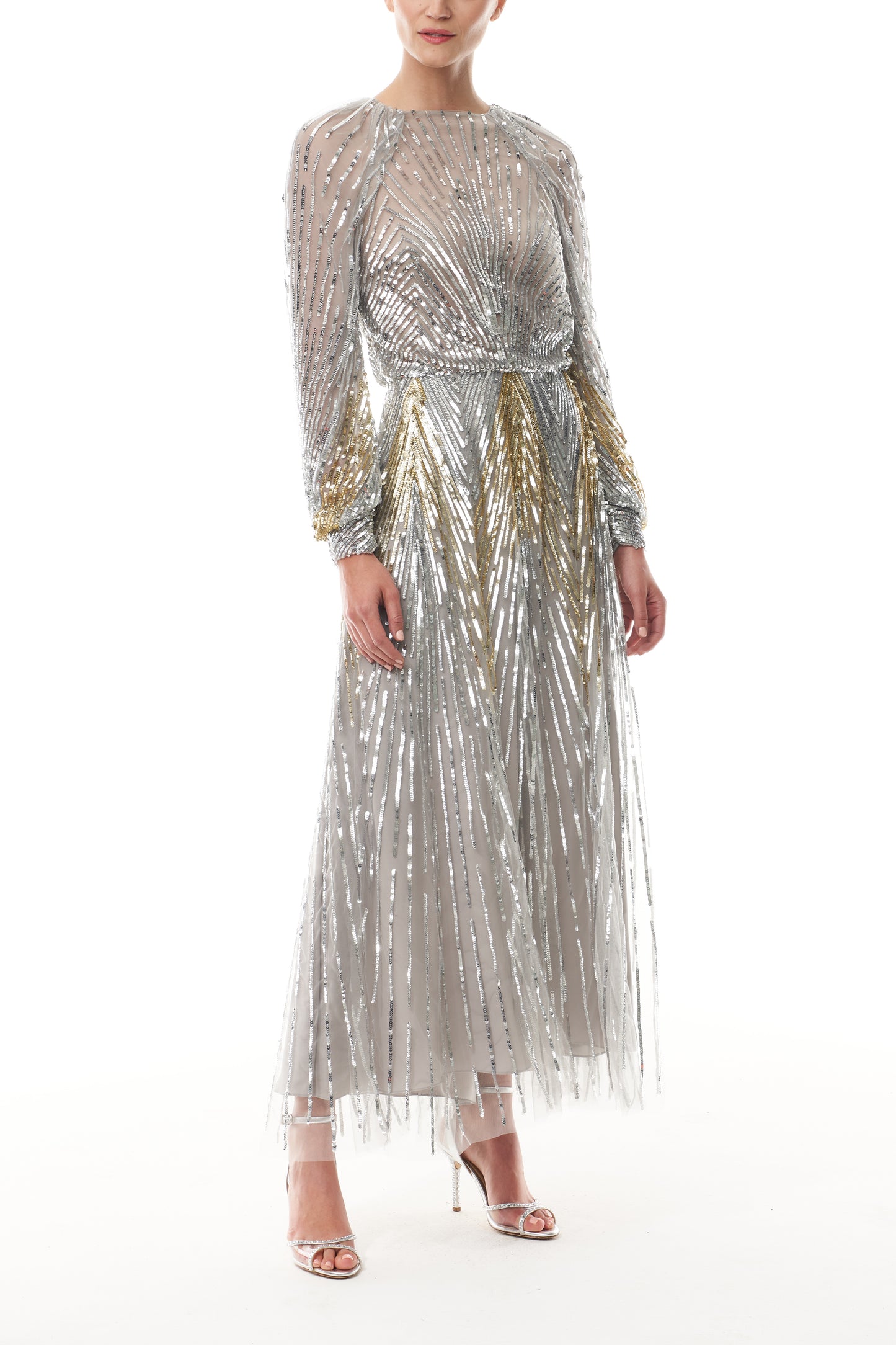 Long sleeve midi dress in silver & gold sequin embroidery with semi-sheer bodice - side.
