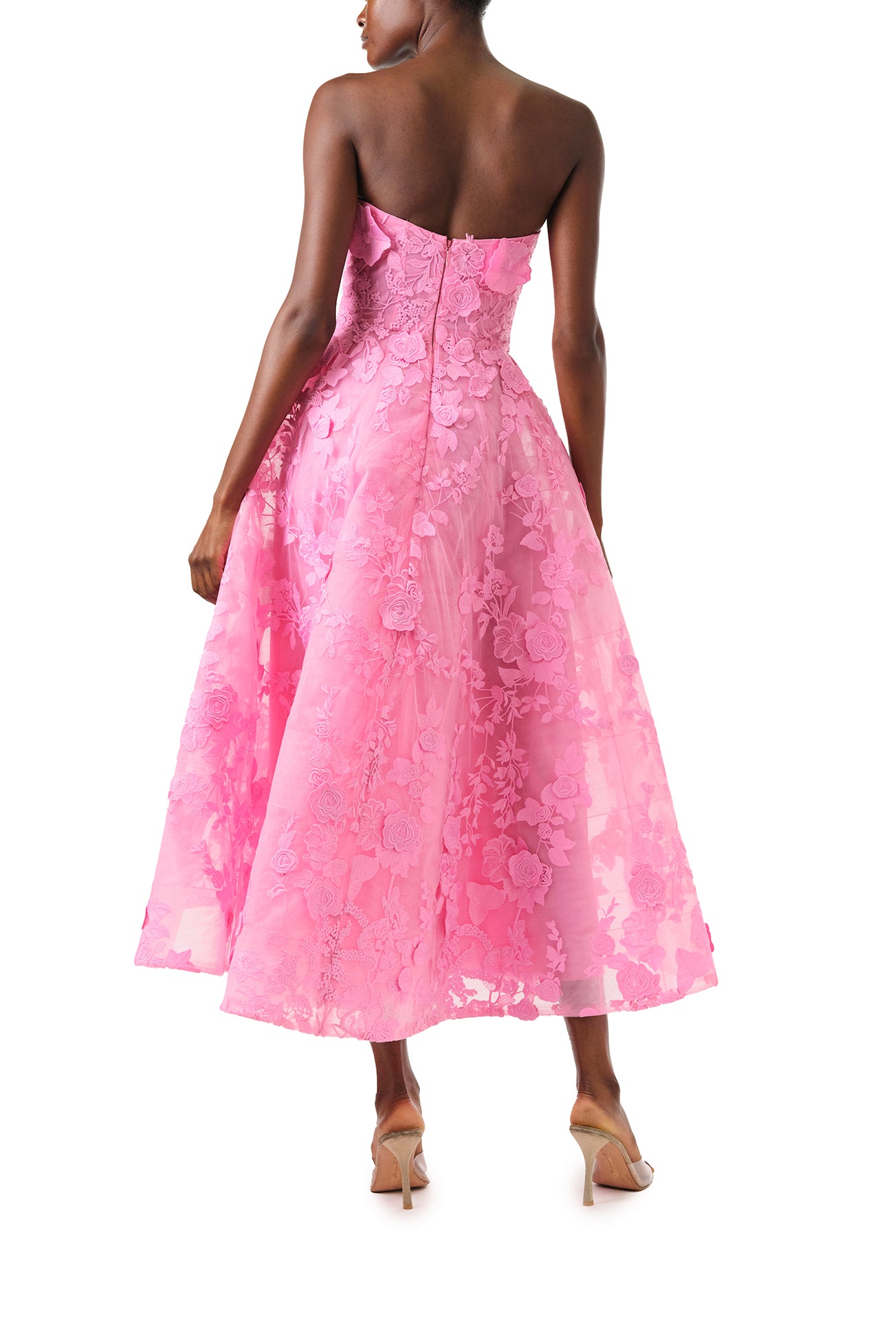 Monique Lhuillier Fall 2024 tea-length, strapless dress in pink 3D lace with full skirt and fitted sweetheart bodice - back.