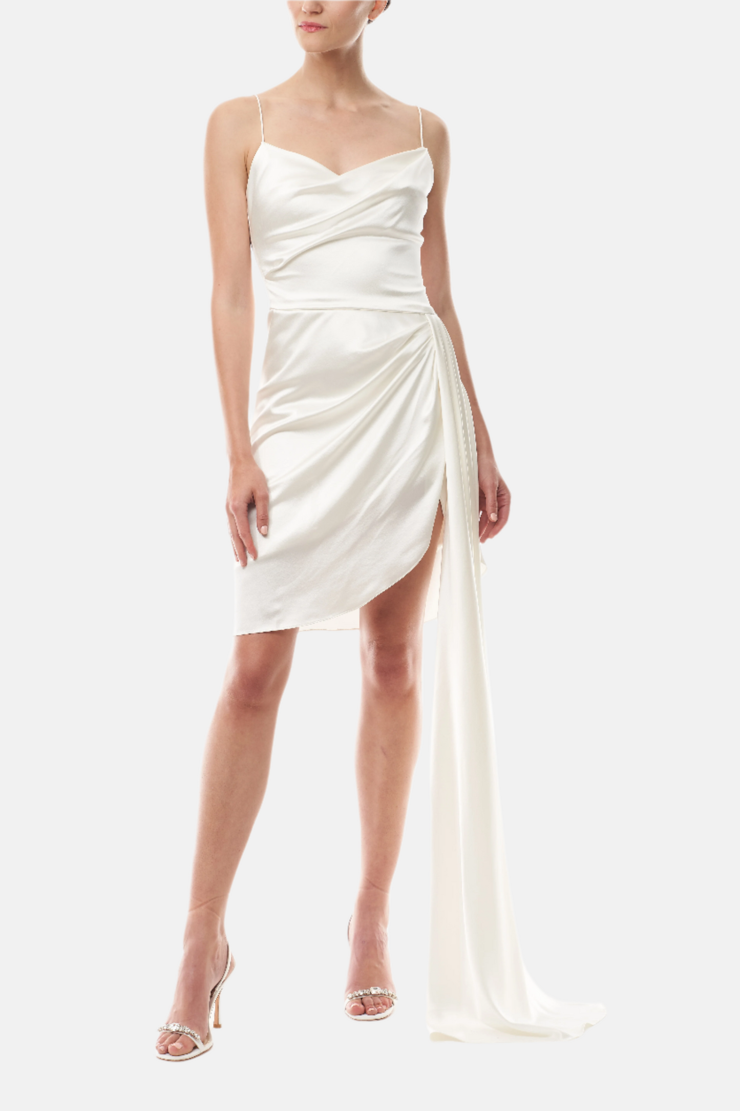 Silk white satin mini dress with asymmetric hem, side sweeping train and spaghetti straps - front.