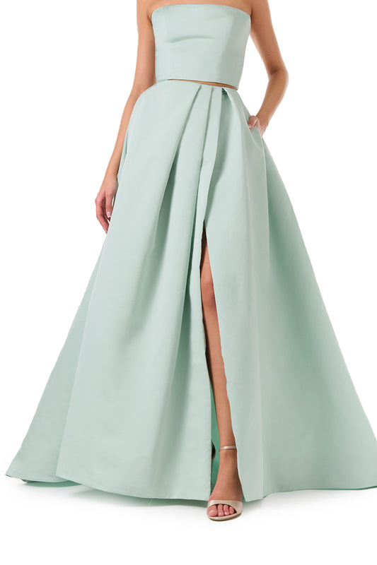 Monique Lhuillier Spring 2023 ball skirt with front slit in pistachio silk faille fabric - slit detail.