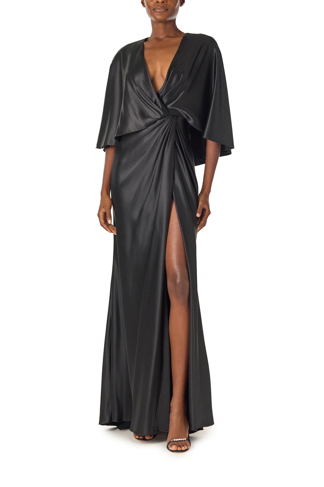 Monique Lhuillier deep V-Neck draped gown with attached capelet and high leg slit in black crepe back satin - front.