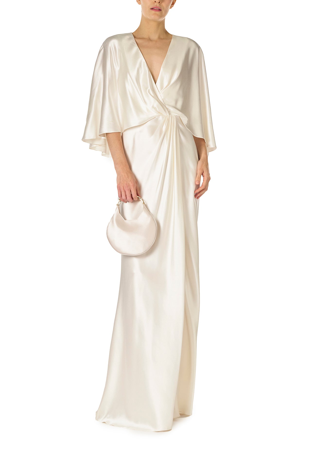 Monique Lhuillier deep V-Neck draped gown with attached capelet and high leg slit in silk white crepe back satin - front with slit closed.