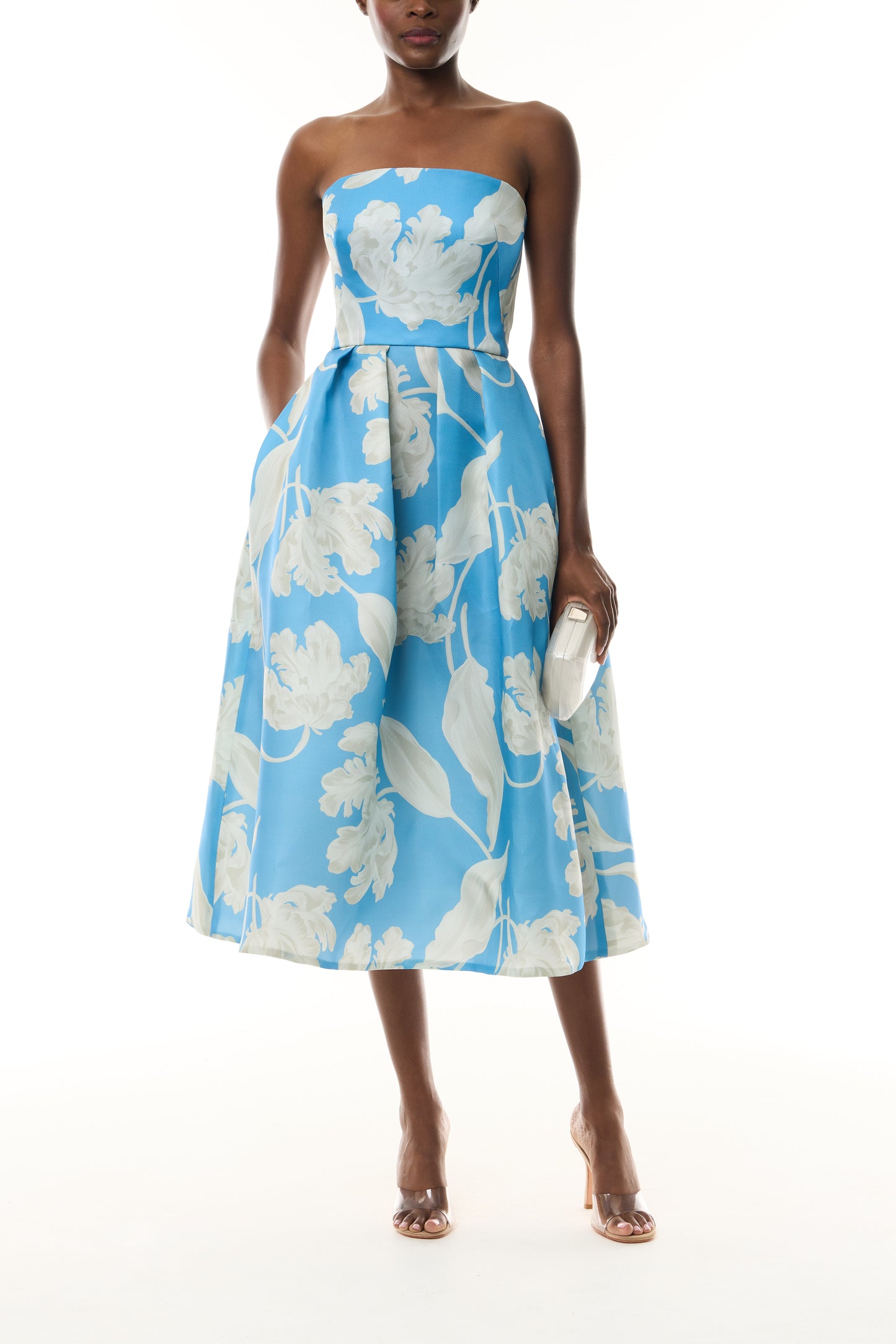 Monique Lhuillier Spring 2023 Bluebelle/Multi Floral Printed Pique Gazar strapless full skirt midi dress with pockets - front with Crystal Dust Dasha Minaudière.