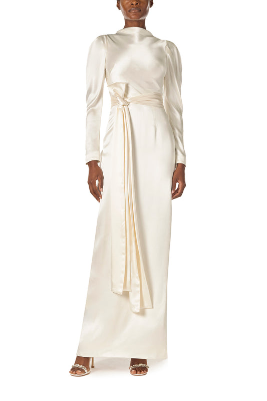 Monique Lhuillier Fall 2024 Long sleeve silk white satin gown with Bateau neckline, V-back and detached self-tie sash - front.