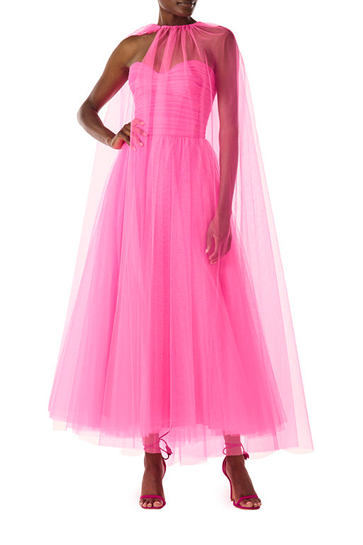 Monique Lhuillier hot pink tulle cape shown over the strapless dress with sweetheart neckline and ruched bodice.