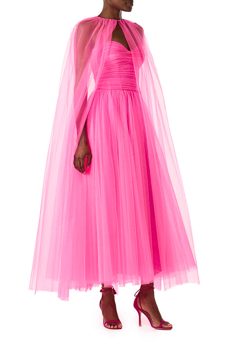 Monique Lhuillier hot pink tulle cape shown over the strapless dress with sweetheart neckline and ruched bodice.