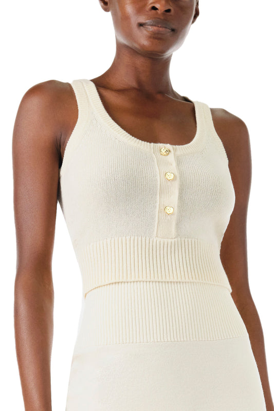 Monique Lhuillier Spring 2024 white cropped cashmere tank with scoop neck and gold button closure - front detail.