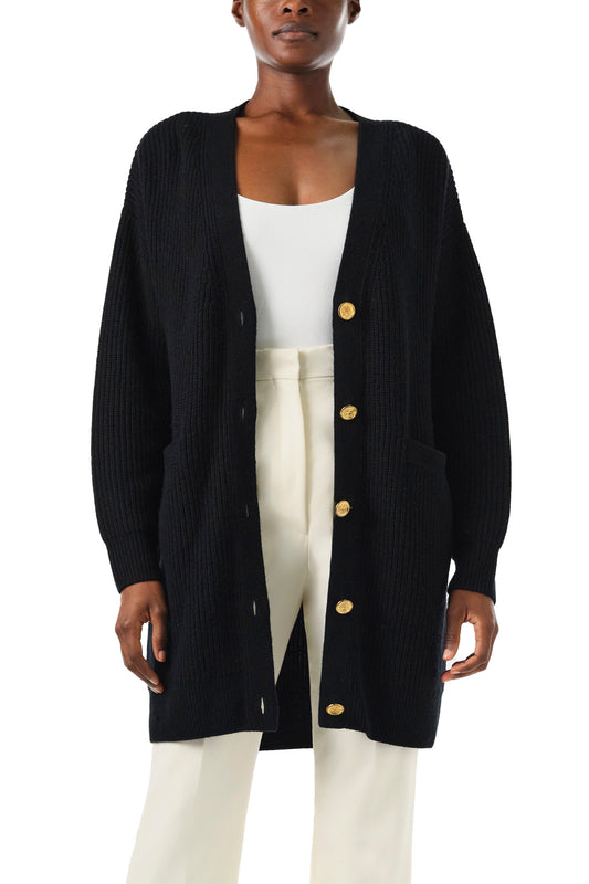 Monique Lhuillier Spring 2024 black chunky long cashmere cardigan with gold buttons - front crop.