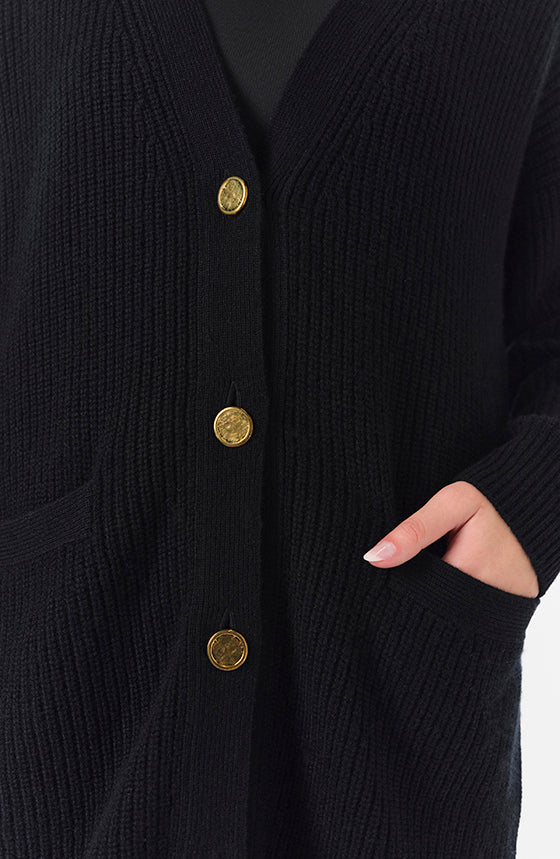 Monique Lhuillier Spring 2024 black chunky long cashmere cardigan with gold buttons - detail.