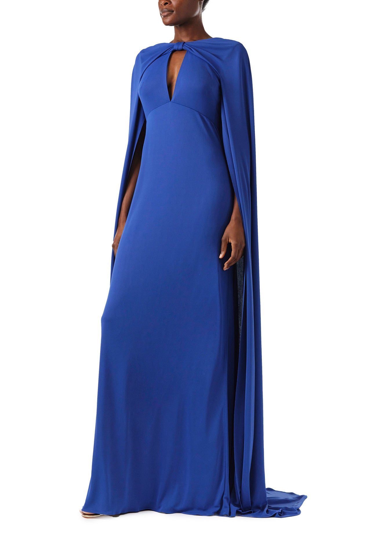 Monique Lhuillier Spring 2024 royal blue crepe-back satin gown with attached cape and keyhole bodice - left.