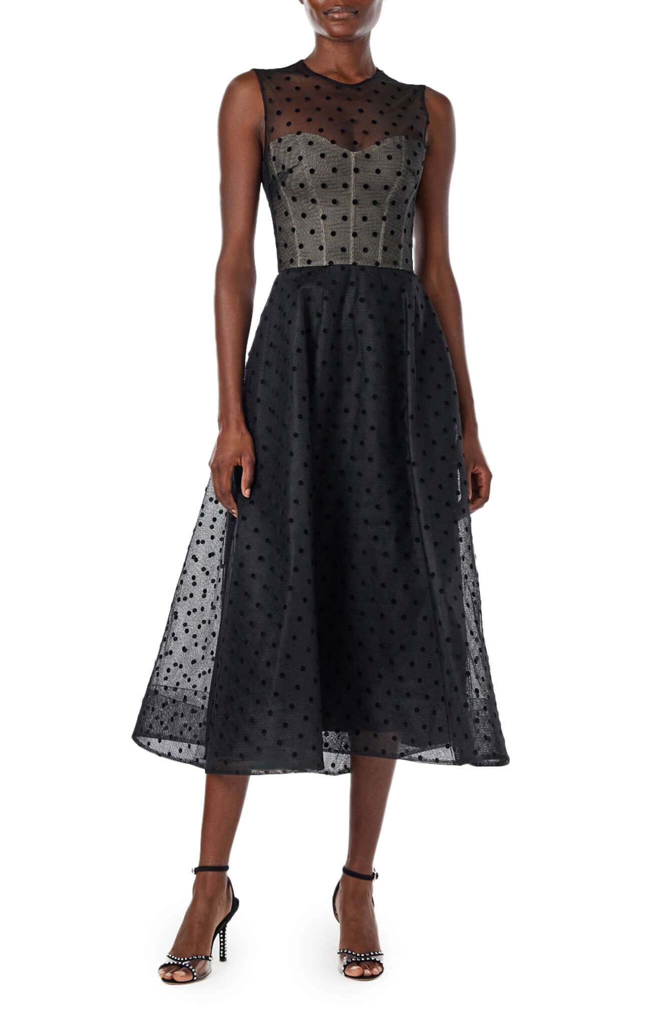 Monique Lhuillier noir dotted tulle, sleeveless jewel neck cocktail dress with caged skirt.