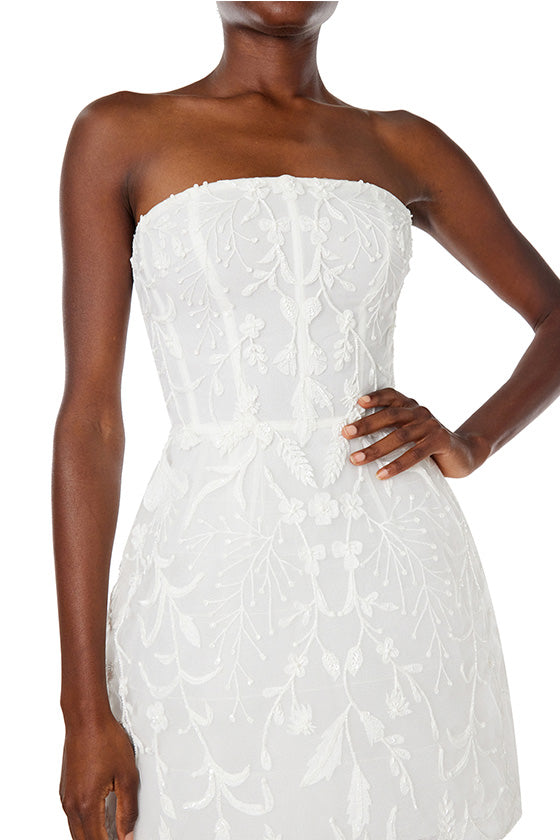Monique Lhuillier Spring 2024 strapless, embroidered cocktail dress with structured skirt.