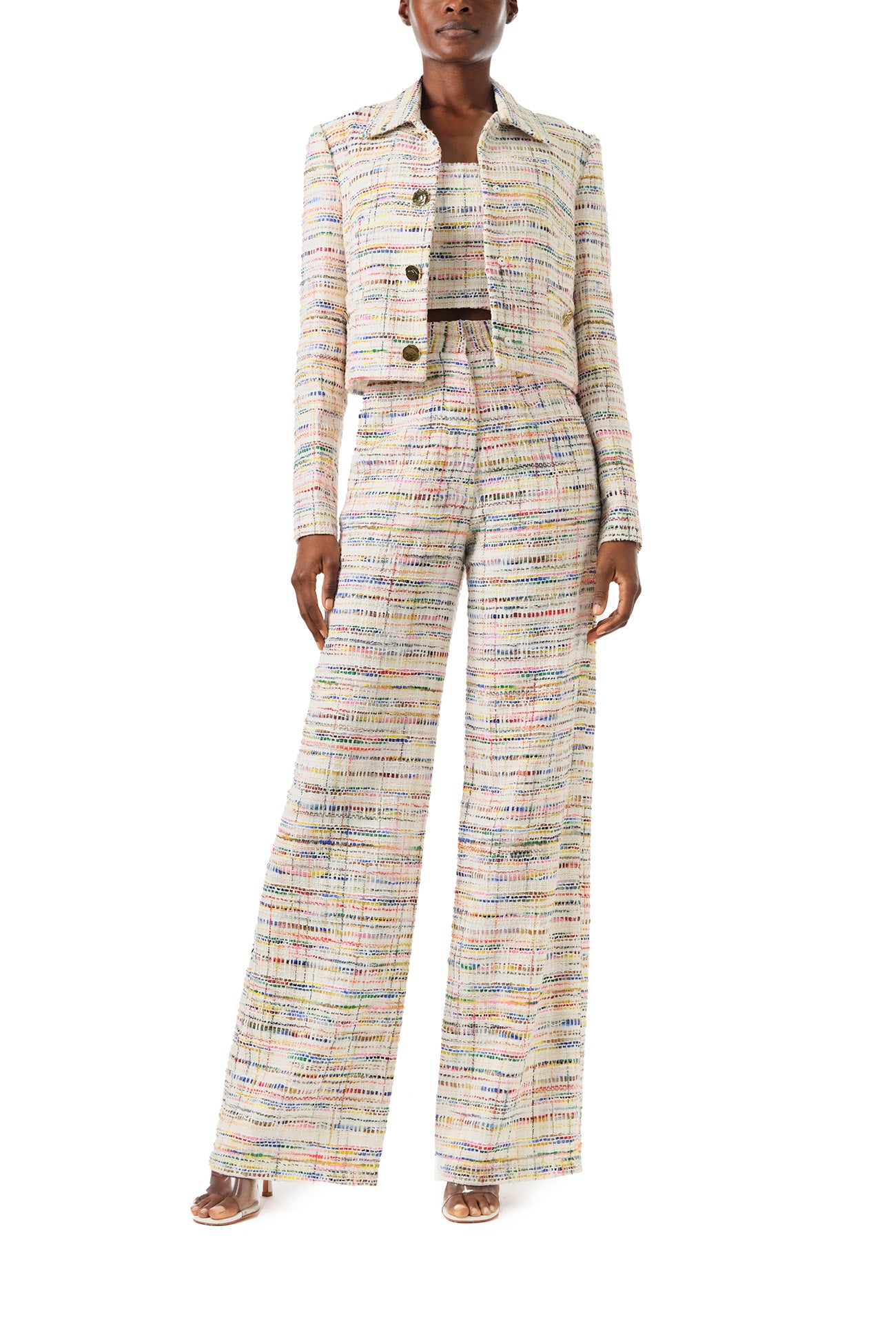 Monique Lhuillier Spring 2024 silk white multi colored tweed cropped jacket shown with high waisted trousers - front .