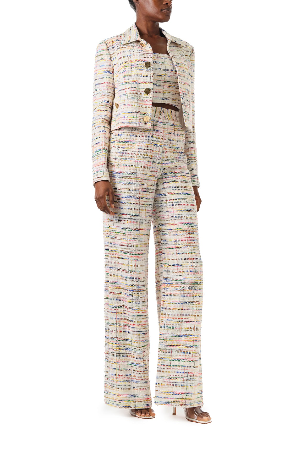 Monique Lhuillier Spring 2024 silk white multi colored tweed cropped jacket shown with high waisted trousers - front.