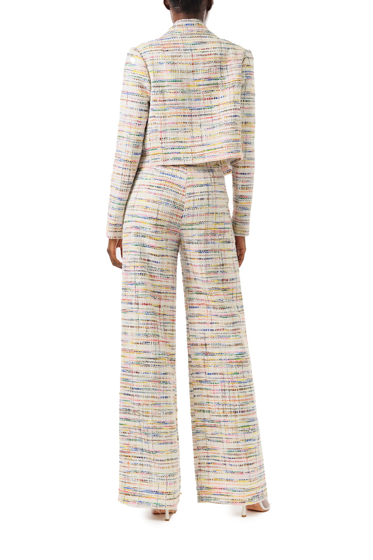 Monique Lhuillier Spring 2024 silk white multi colored tweed cropped jacket shown with high waisted trousers - back.