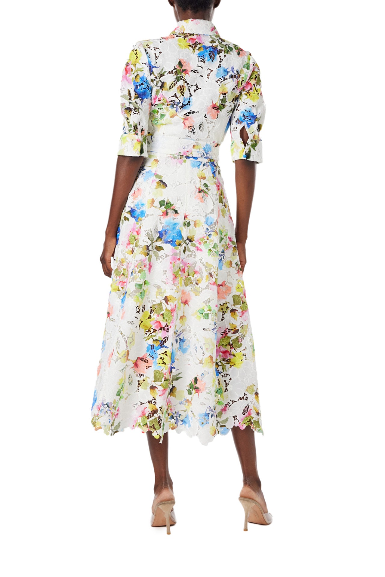 Monique Lhuillier Spring 2024 silk white floral printed lace shirt dress with pockets and a scalloped hem - back.