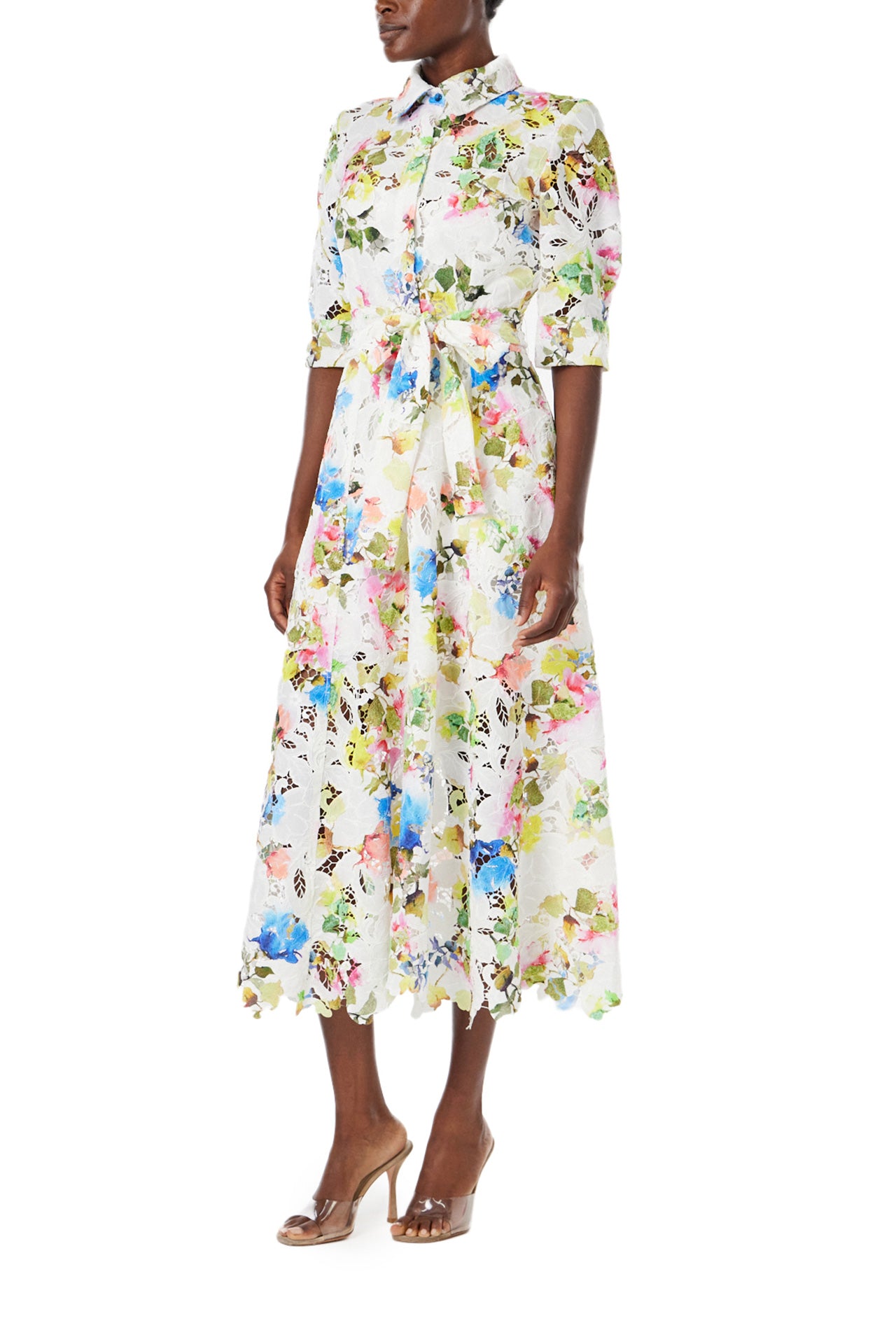 Monique Lhuillier Spring 2024 silk white floral printed lace shirt dress with pockets and a scalloped hem - left side.