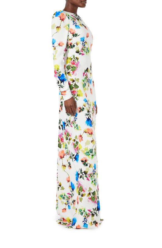 Monique Lhuillier Spring 2024 floral print long sleeve gown with open back and ruching - side one.