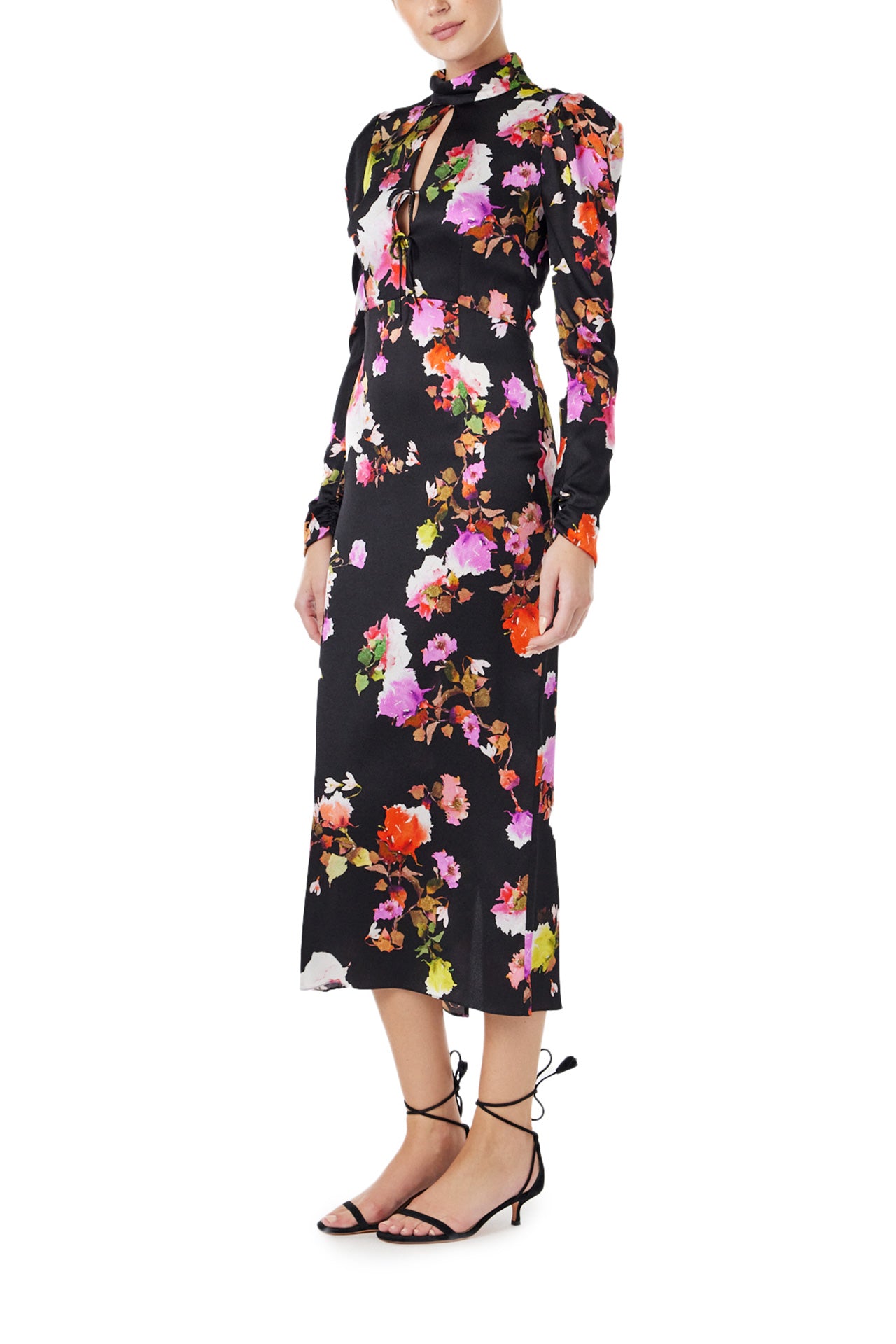 Monique Lhuillier Spring 2024 long sleeve midi dress with high neck and tied front keyhole bodice in black floral hammered silk - left.