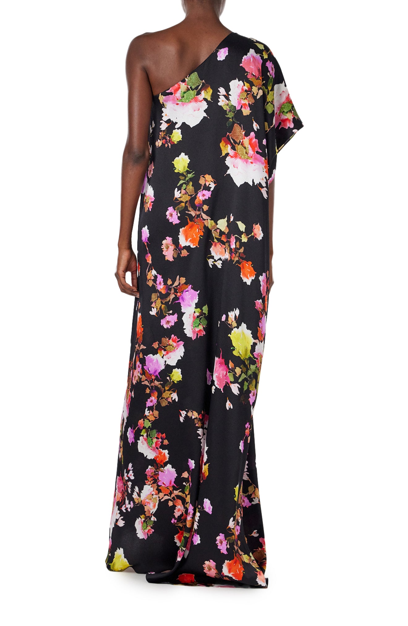Monique Lhuillier Spring 2024 one shoulder caftan with bias flounce in noir/multi floral hammered silk - back.