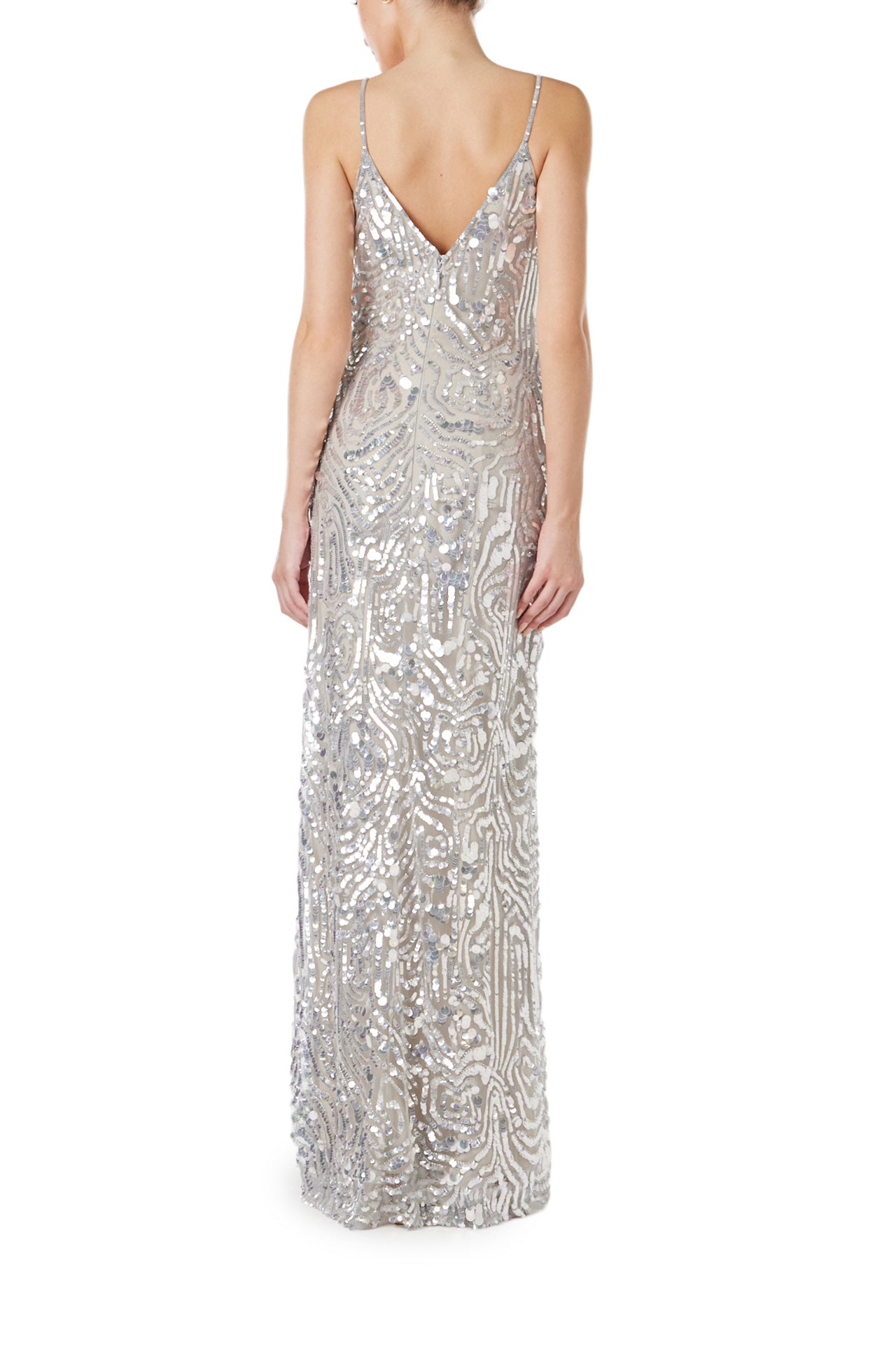 Monique Lhuillier Spring 2024 silver sequin slip gown with deep v neckline and high front slit - back.