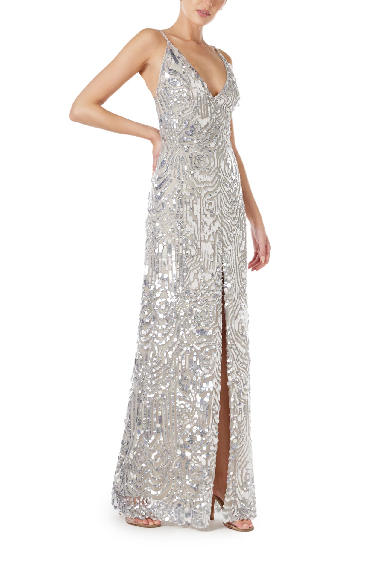 Monique Lhuillier Spring 2024 silver sequin slip gown with deep v neckline and high front slit - right side.