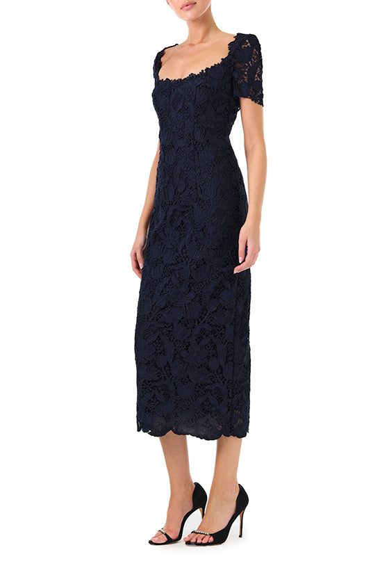 Monique Lhuillier Fall 2024 night sky colored lace sheath dress with short sleeves, scoop neckline and lace scalloped detailing - side.