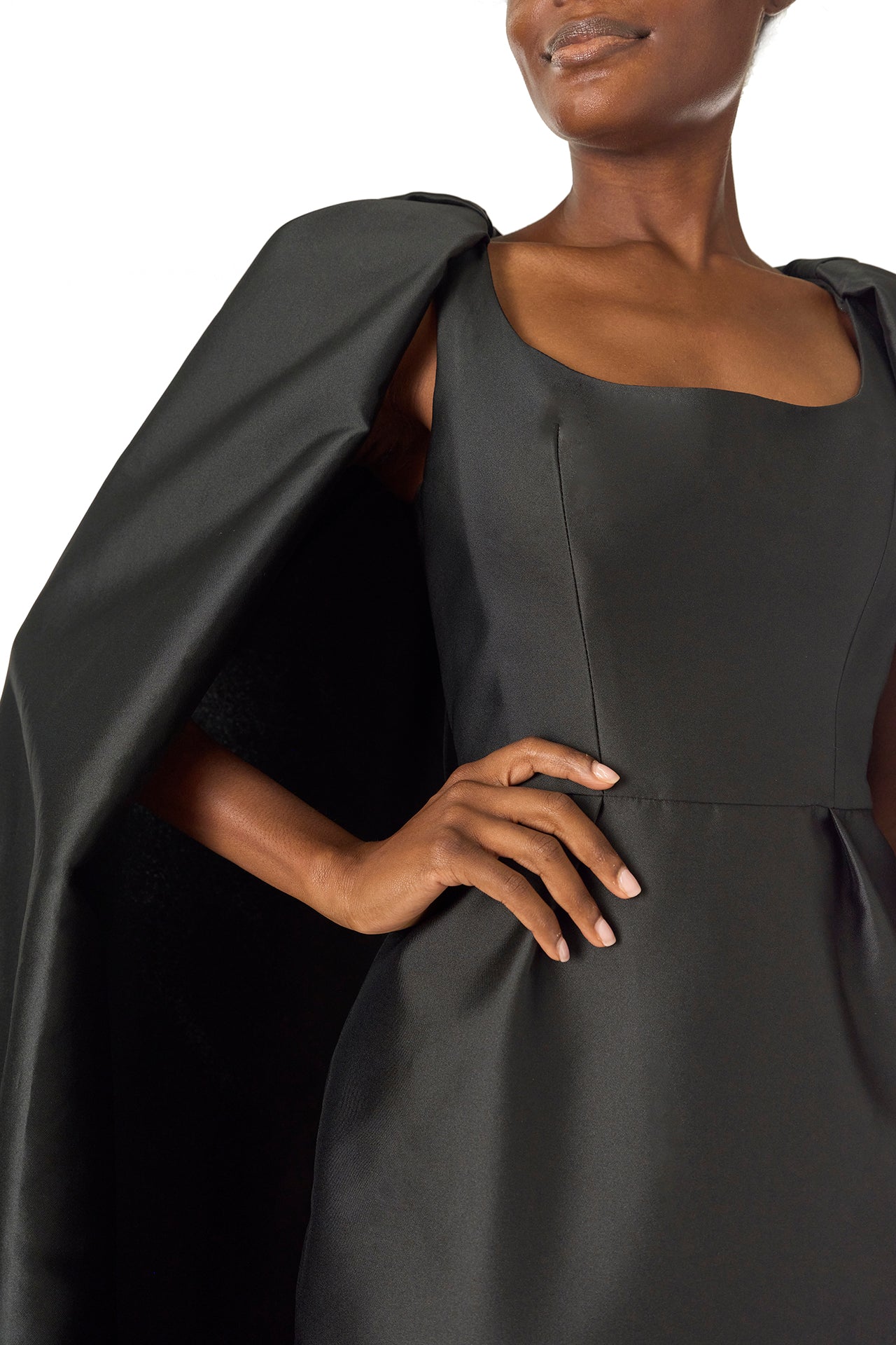 Monique Lhuillier Fall 2024 sleeveless, scoop neck column gown with integral cape in noir mikado fabric - detail.