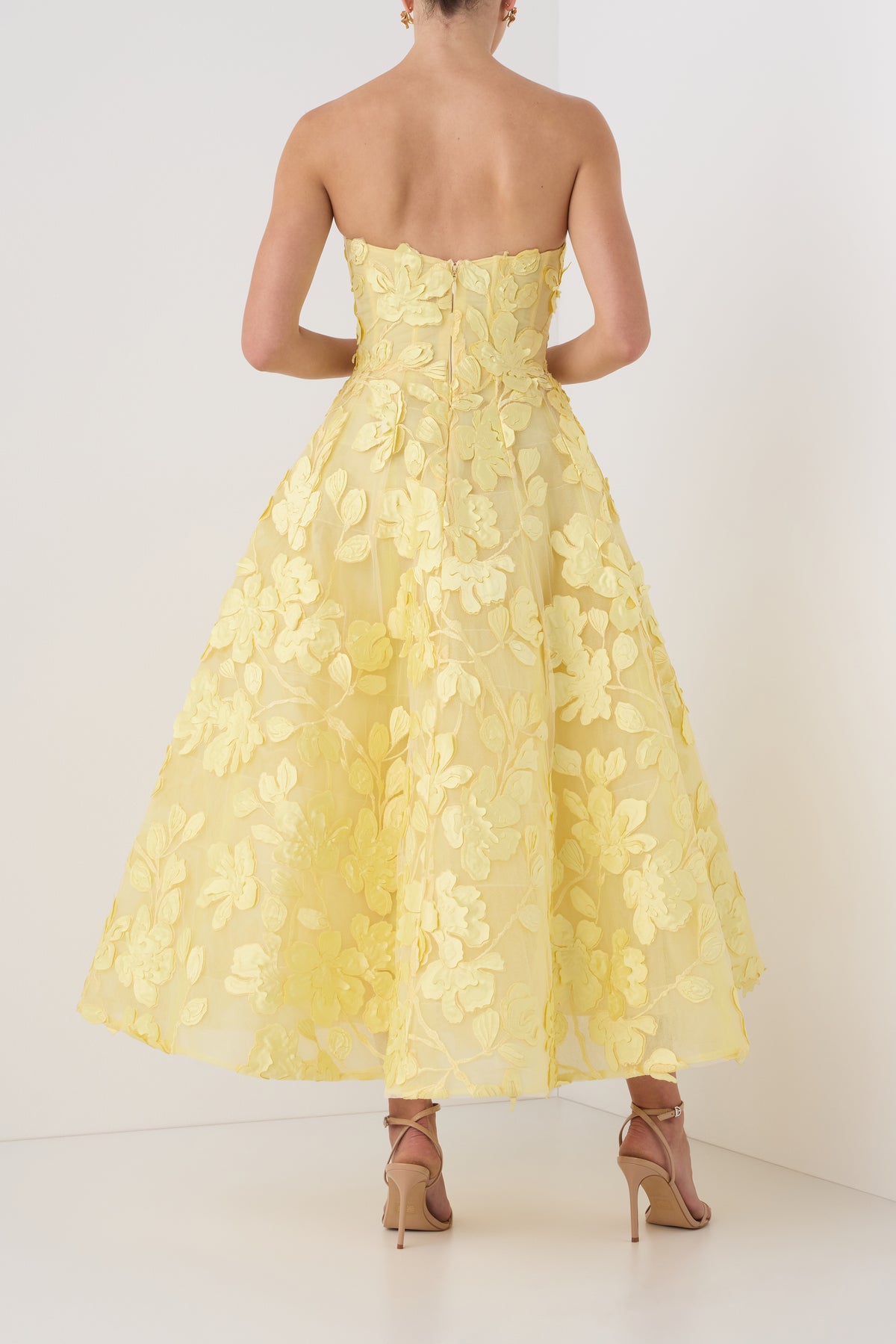 Monique Lhuillier exclusive strapless Pale Yellow tea-length dress in three-dimensional lace - back.