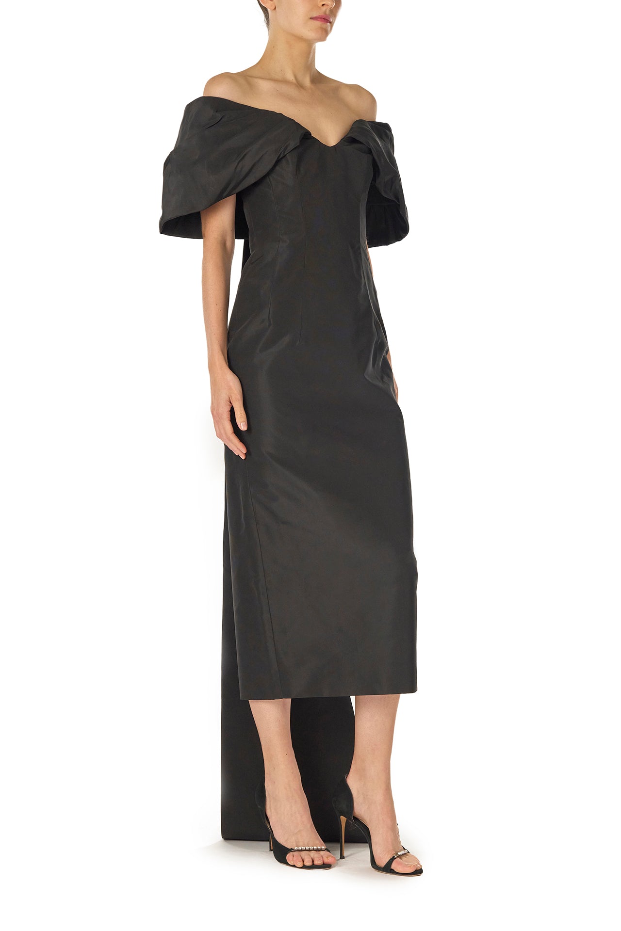 Monique Lhuillier Fall 2024 Off-the-shoulder tea length column dress with draped neckline and train in noir silk faille - right side.