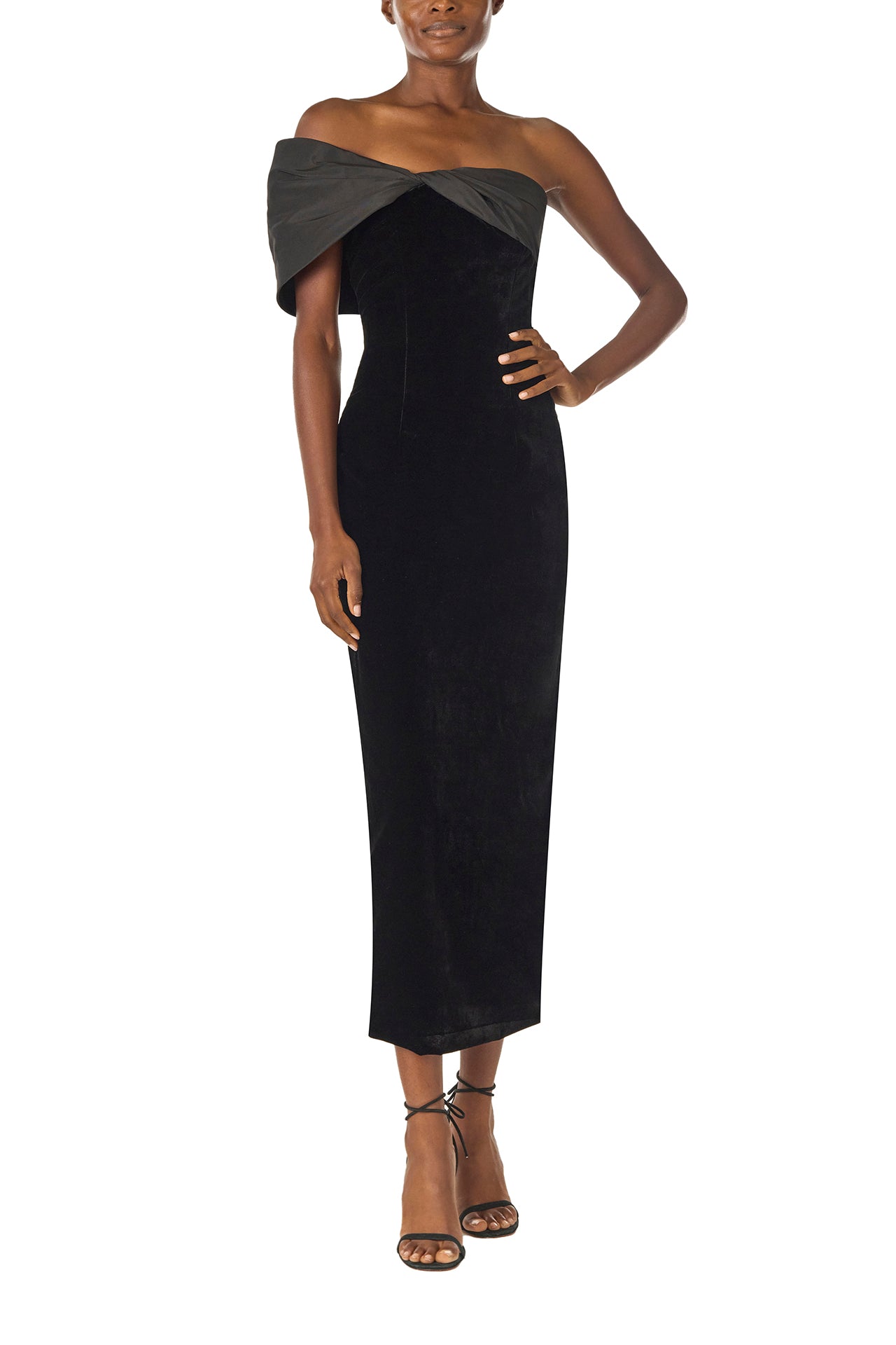 Monique Lhuillier Fall 2024 asymmetric, off the shoulder sheath dress in noir silk faille and velvet with draped twist detail at neckline - front.