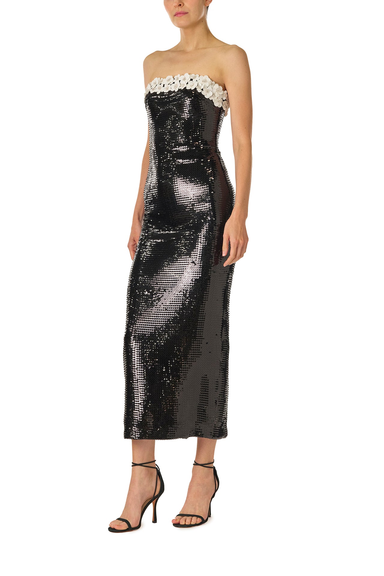 Monique Lhuillier Spring 2025 strapless column gown in noir sequins with silk white floral embroidered neckline - left side.