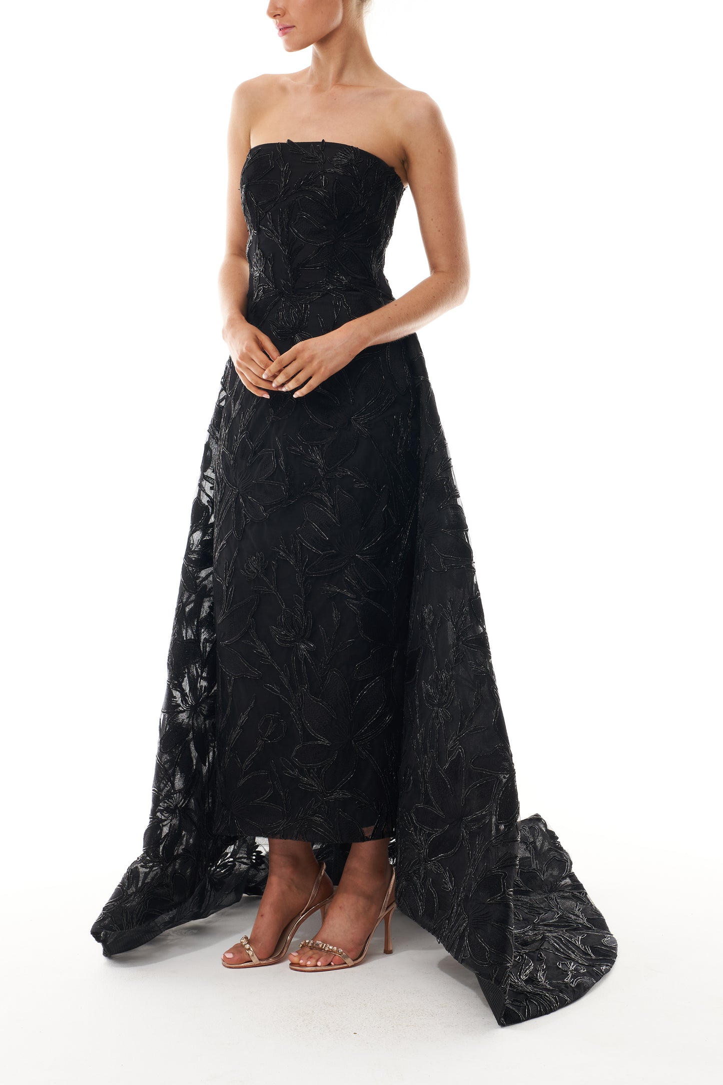 Monique Lhuillier Spring 2025 strapless gown with train in noir embroidery - side.