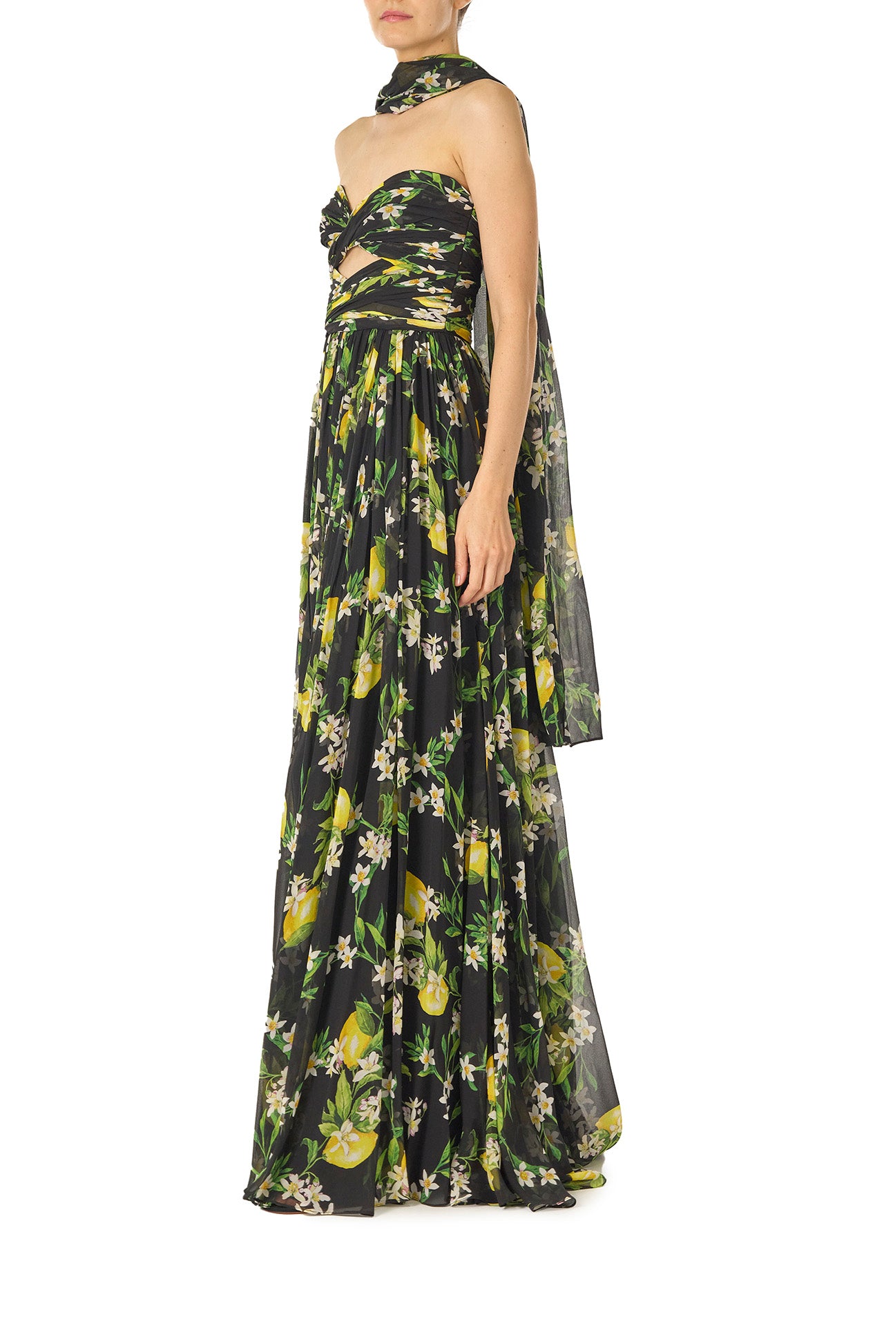 Monique Lhuillier Spring 2025 Strapless gown with draped, cut-out bodice and detached neck scarf in Floral Lemon printed Georgette fabric - left side.