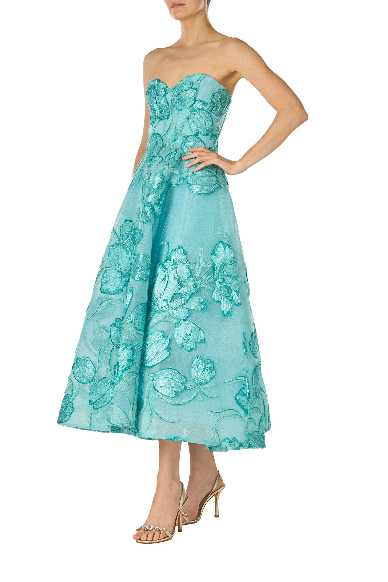 Monique Lhuillier strapless, tea-length dress with corseted sweetheart bodice and structured skirt in Aqua embroidered floral tulle - left side.