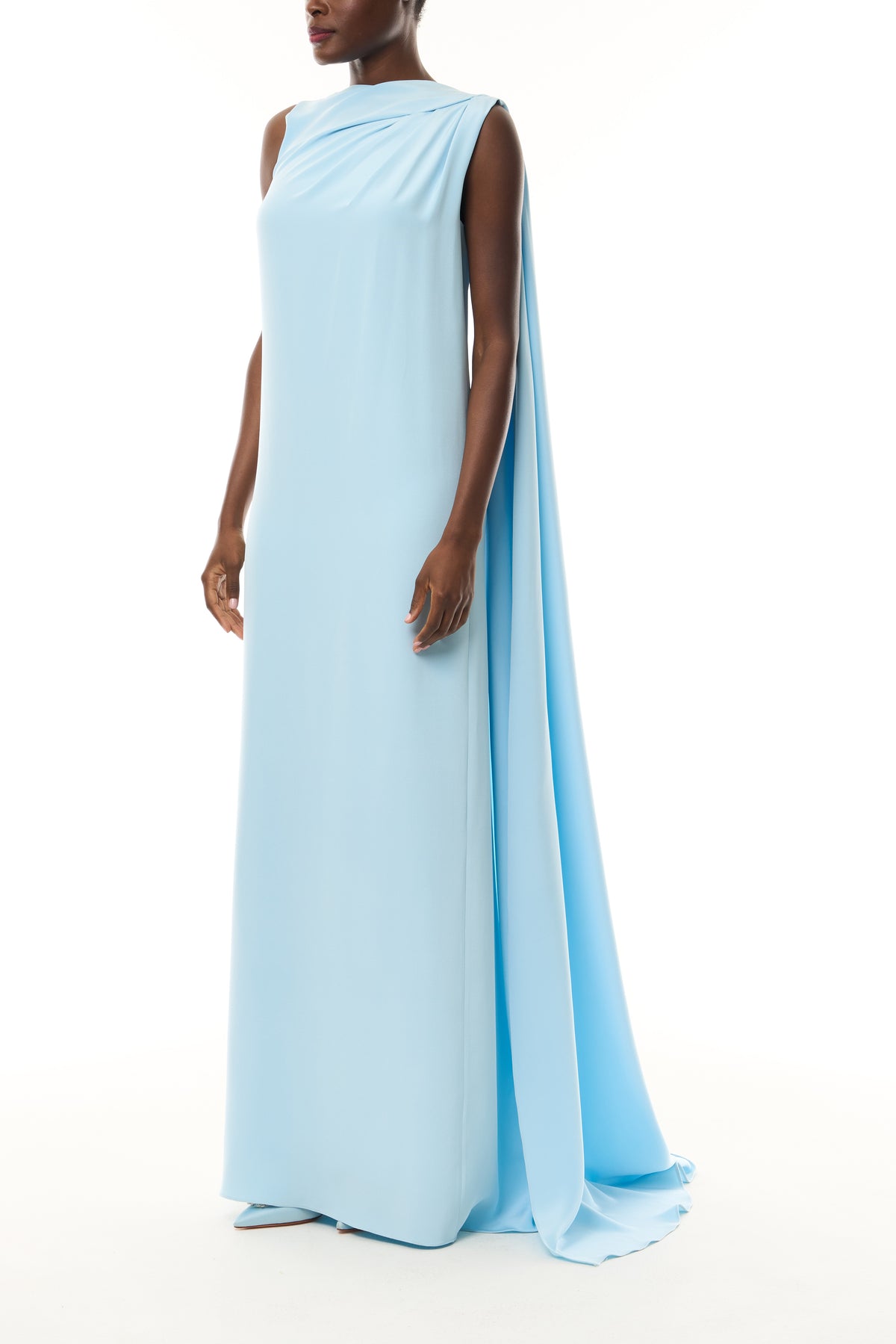 Monique Lhuillier Spring 2026 Powder Blue Crepe Draped Caftan Gown with integral back streamer and low v-back - side.