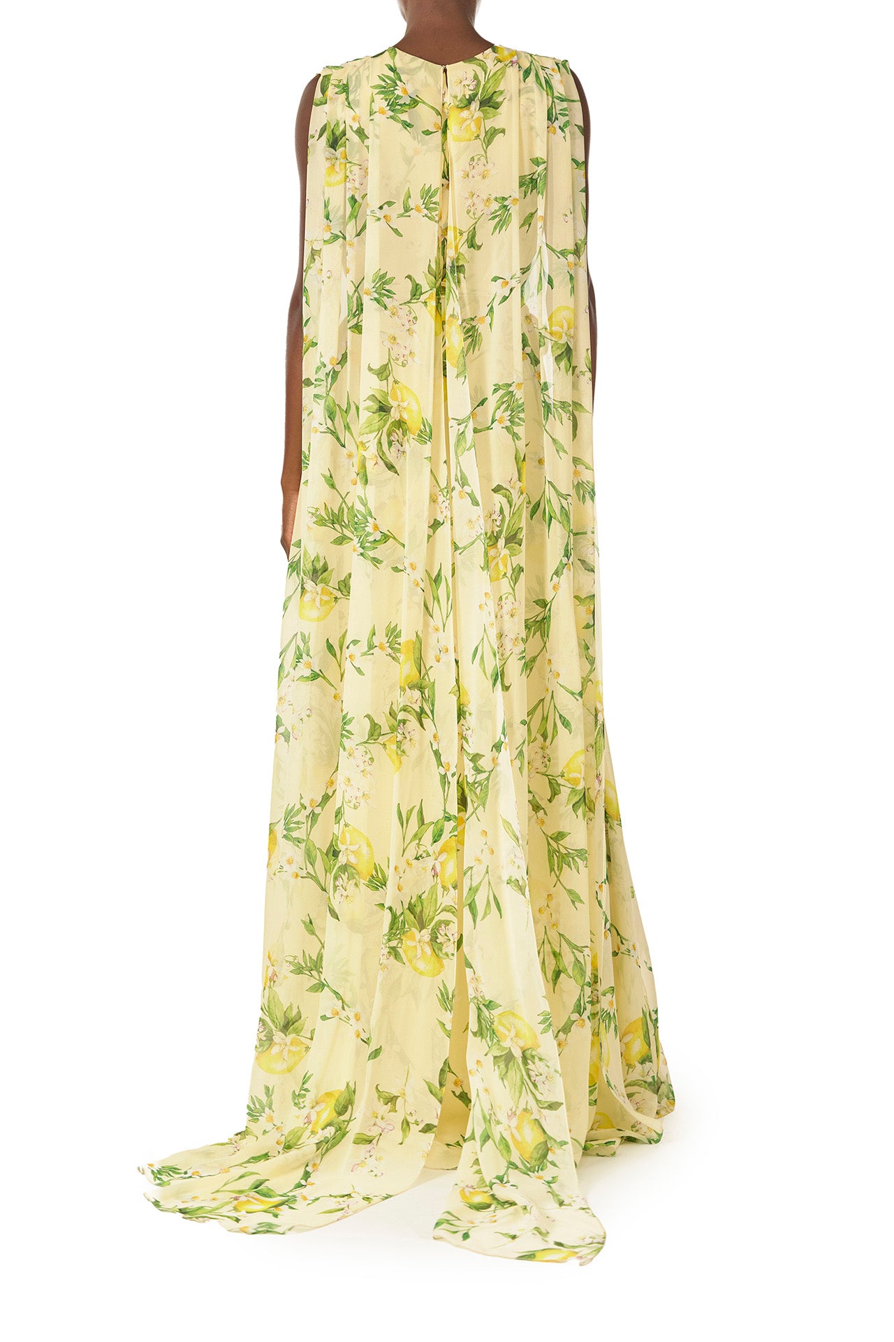 Monique Lhuillier Spring 2025 Lemon printed georgette sleeveless draped gown with integral cape - back.
