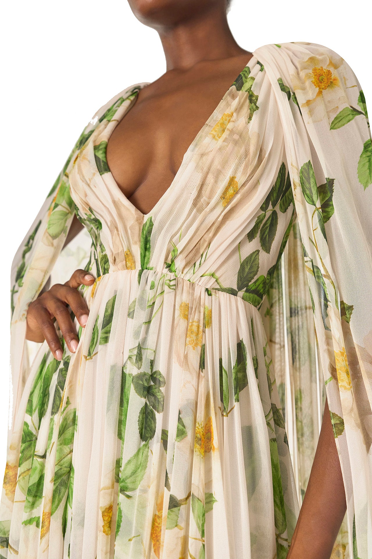 Monique Lhuillier Spring 2025 Draped, v-neck gown in Rose Printed Chiffon with low back and flowing, integral cape - neckline.