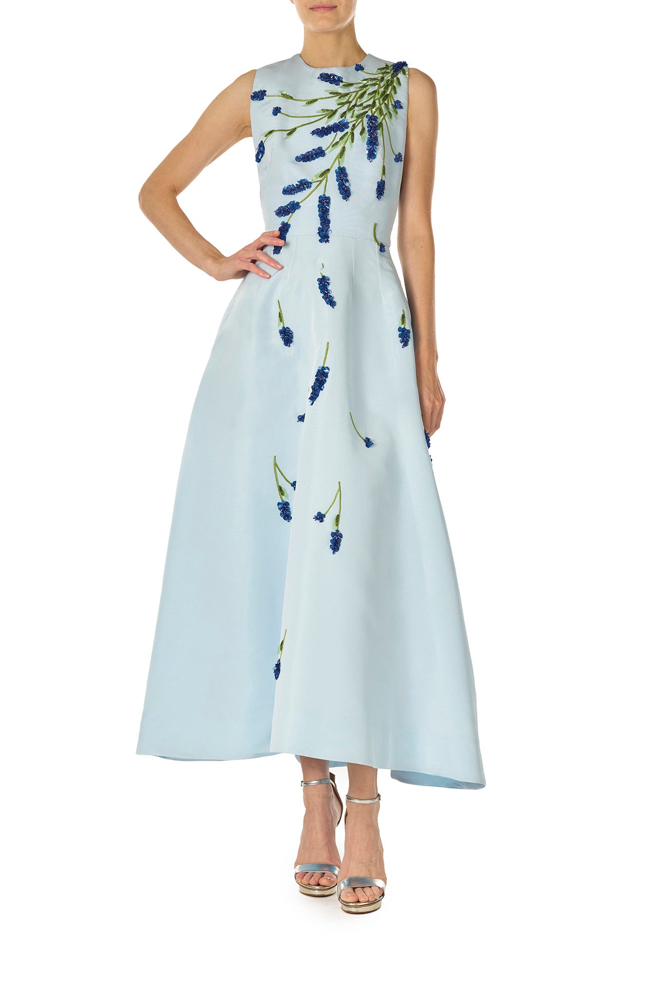 Monique Lhuillier Spring 2025 Sleeveless, tea-length dress with pockets in Powder Blue faille with Lavender-patterned embroidery - front.