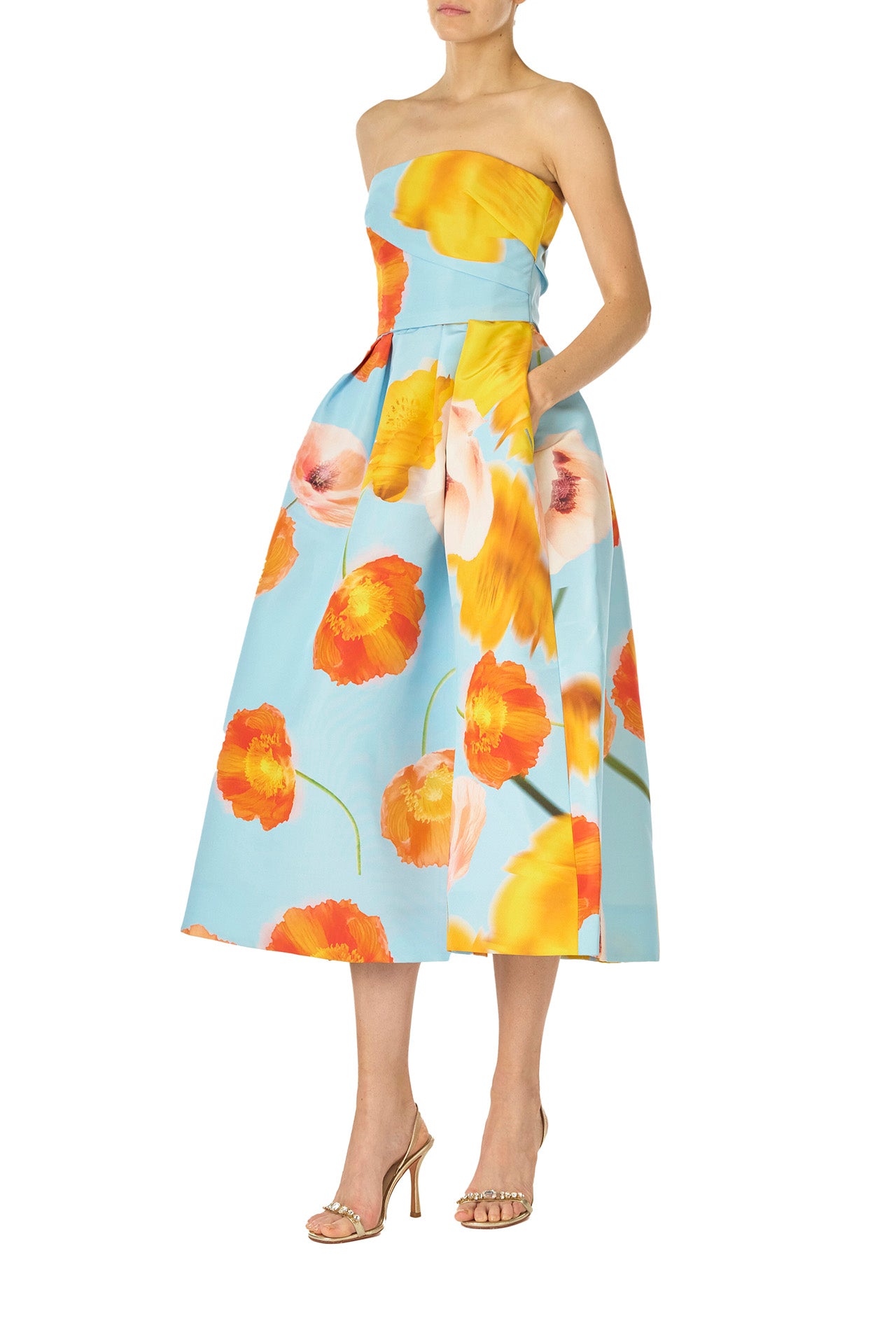 Monique Lhuillier Spring 2025 Strapless tea-length dress with draped bodice and pleated skirt in poppy printed blue faille fabric - left side.