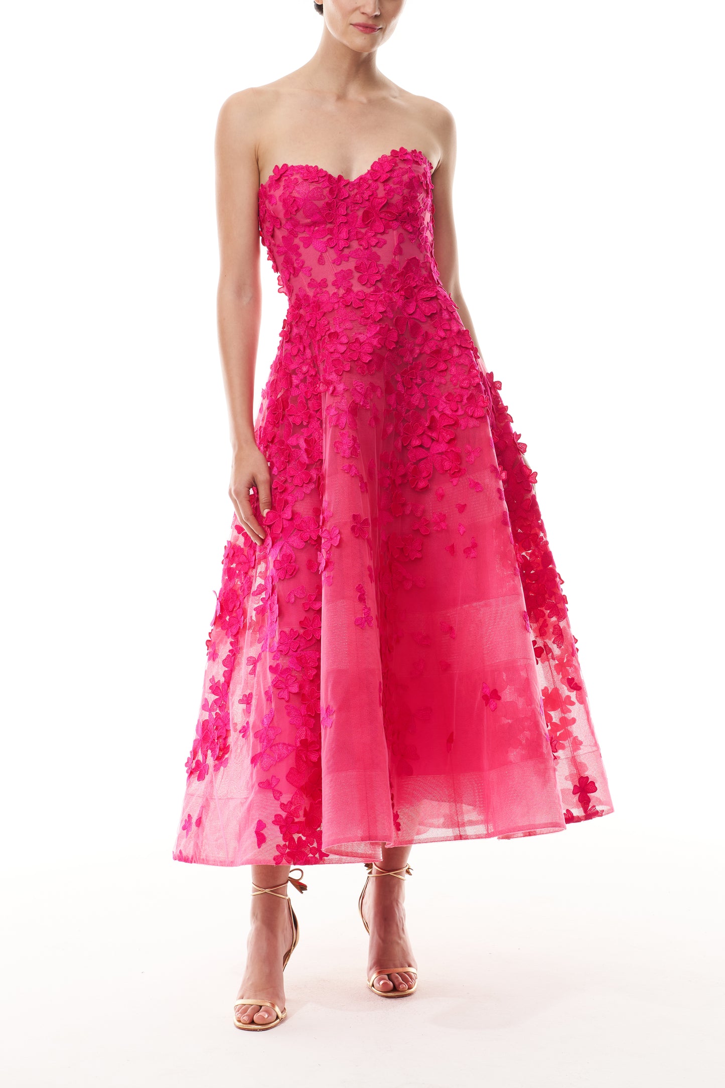 Monique Lhuillier Fall 2026 strapless, tea-length dress with sweetheart neckline in Cerise colored embroidered lace - front.