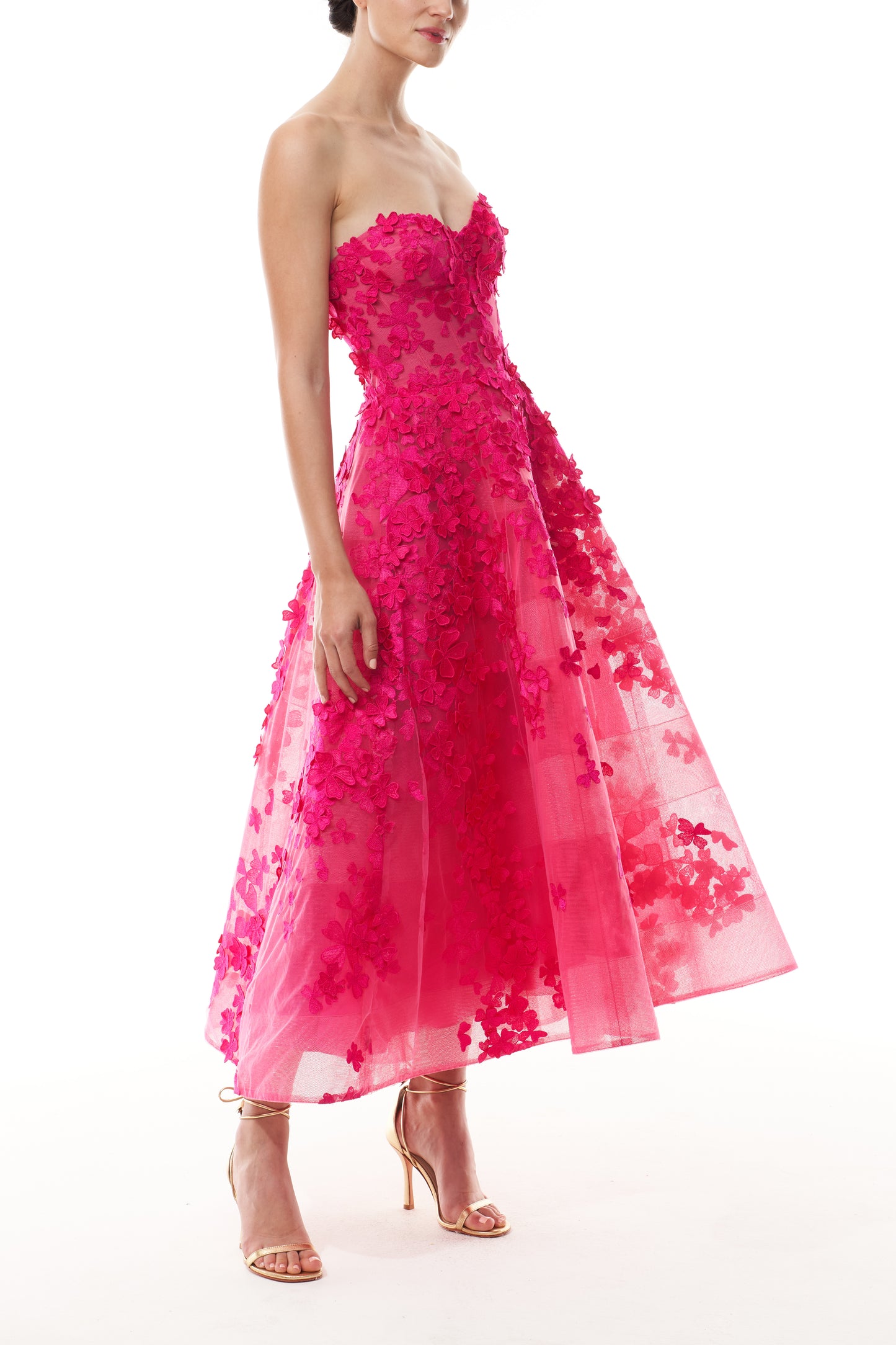 Monique Lhuillier Fall 2026 strapless, tea-length dress with sweetheart neckline in Cerise colored embroidered lace - side.