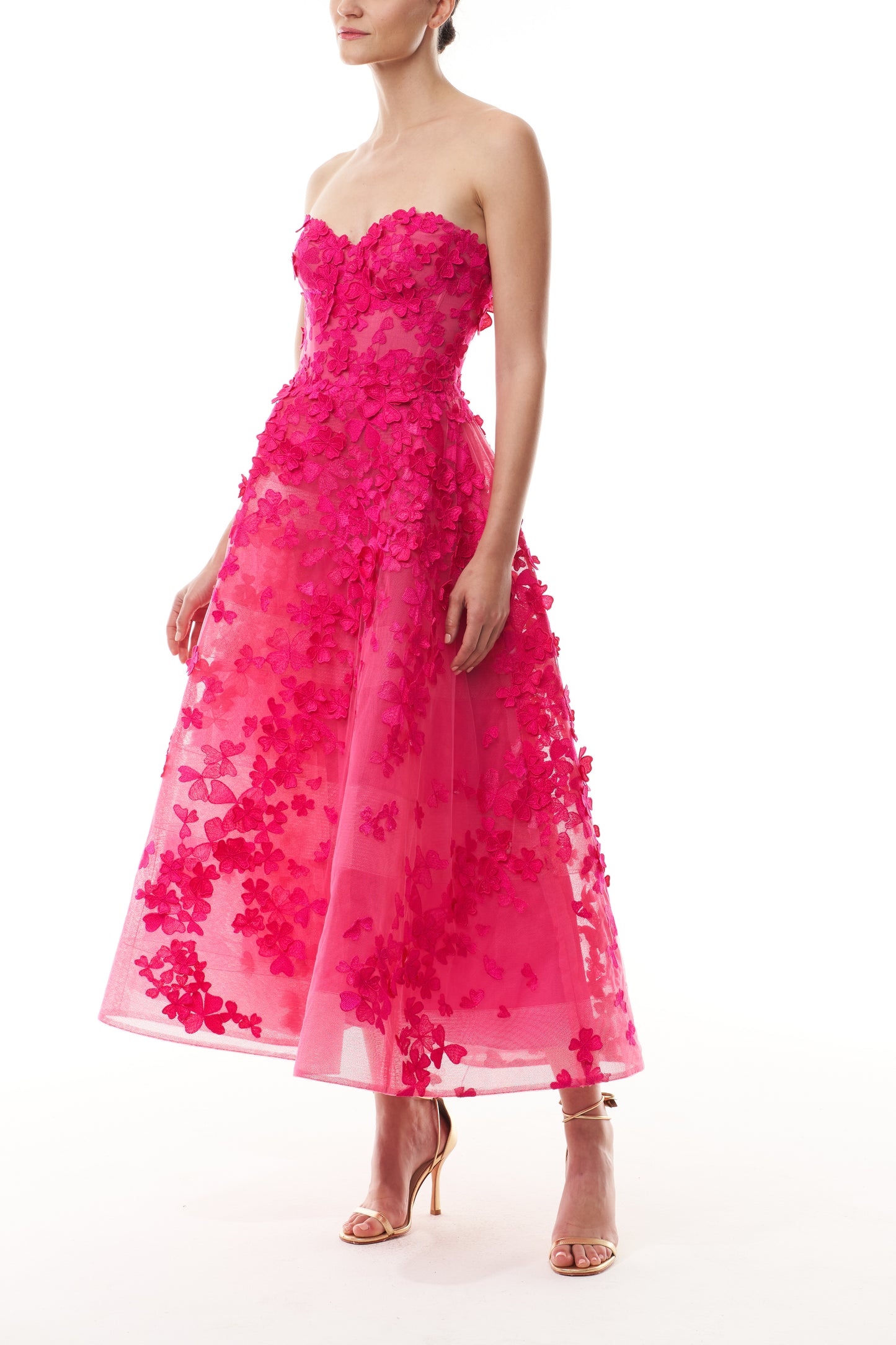 Monique Lhuillier Fall 2026 strapless, tea-length dress with sweetheart neckline in Cerise colored embroidered lace - side.