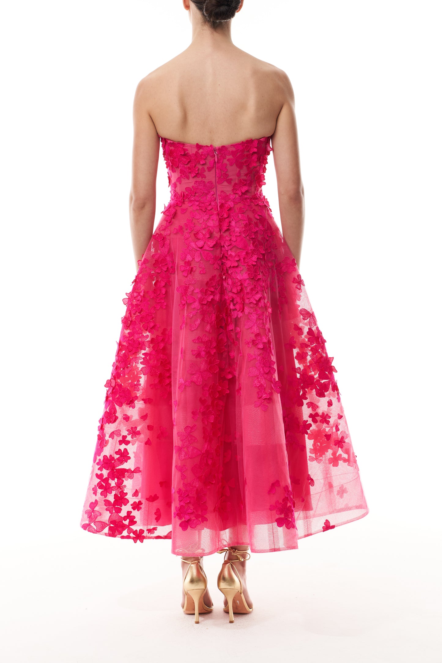 Monique Lhuillier Fall 2026 strapless, tea-length dress with sweetheart neckline in Cerise colored embroidered lace - back.
