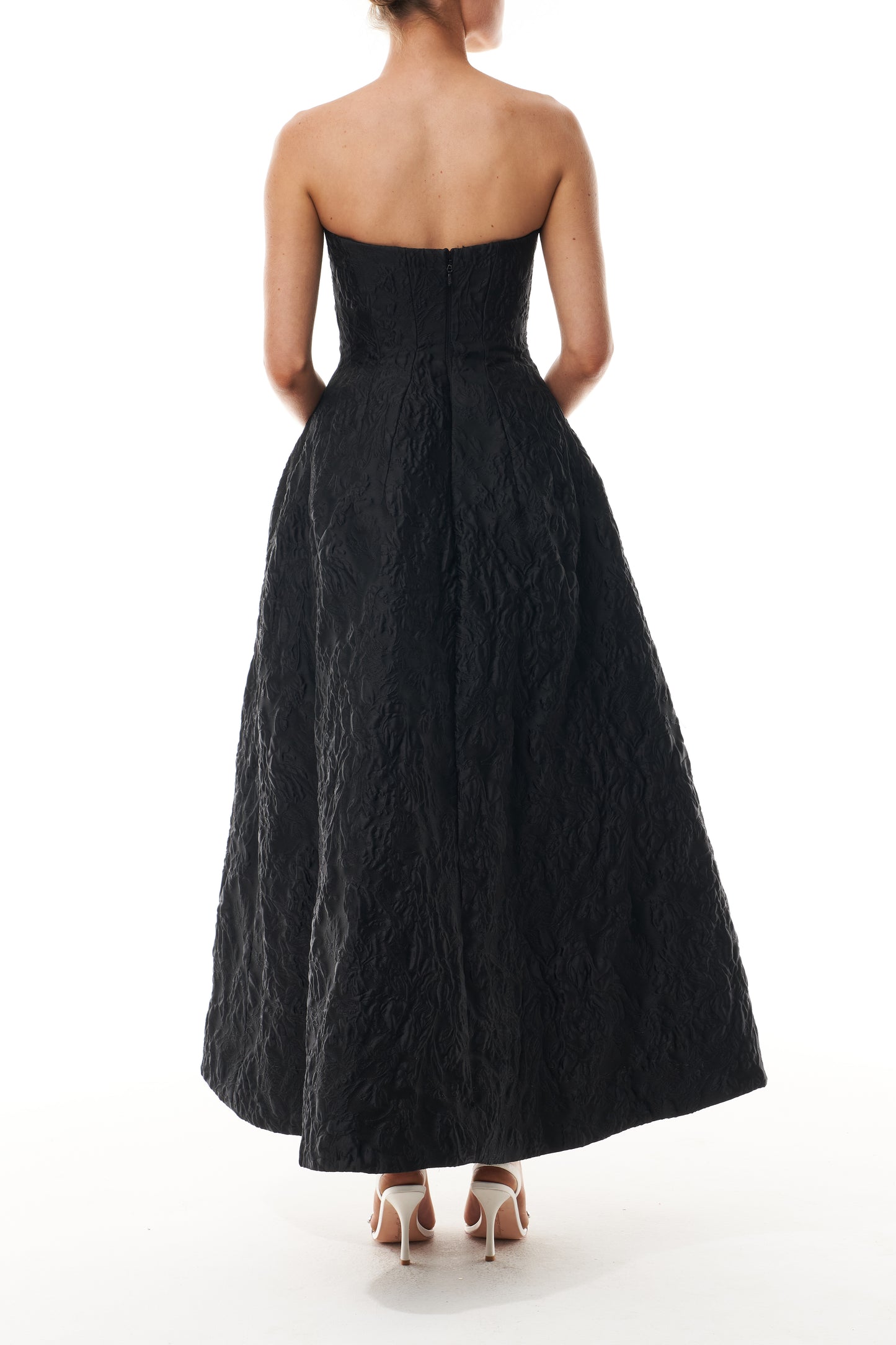 Monique Lhuillier Fall 2025 strapless midi-length dress with pockets in noir floral jacquard - back.