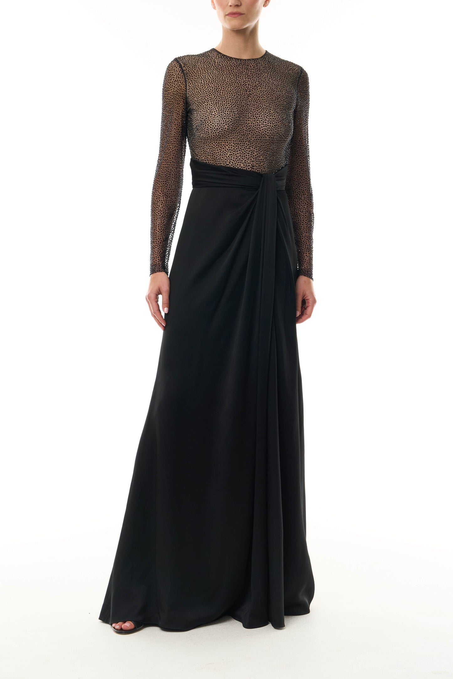 Monique Lhuillier Fall 2025 RTW Noir Long Sleeve Hotfix gown with embellished bodice and front slit - front.