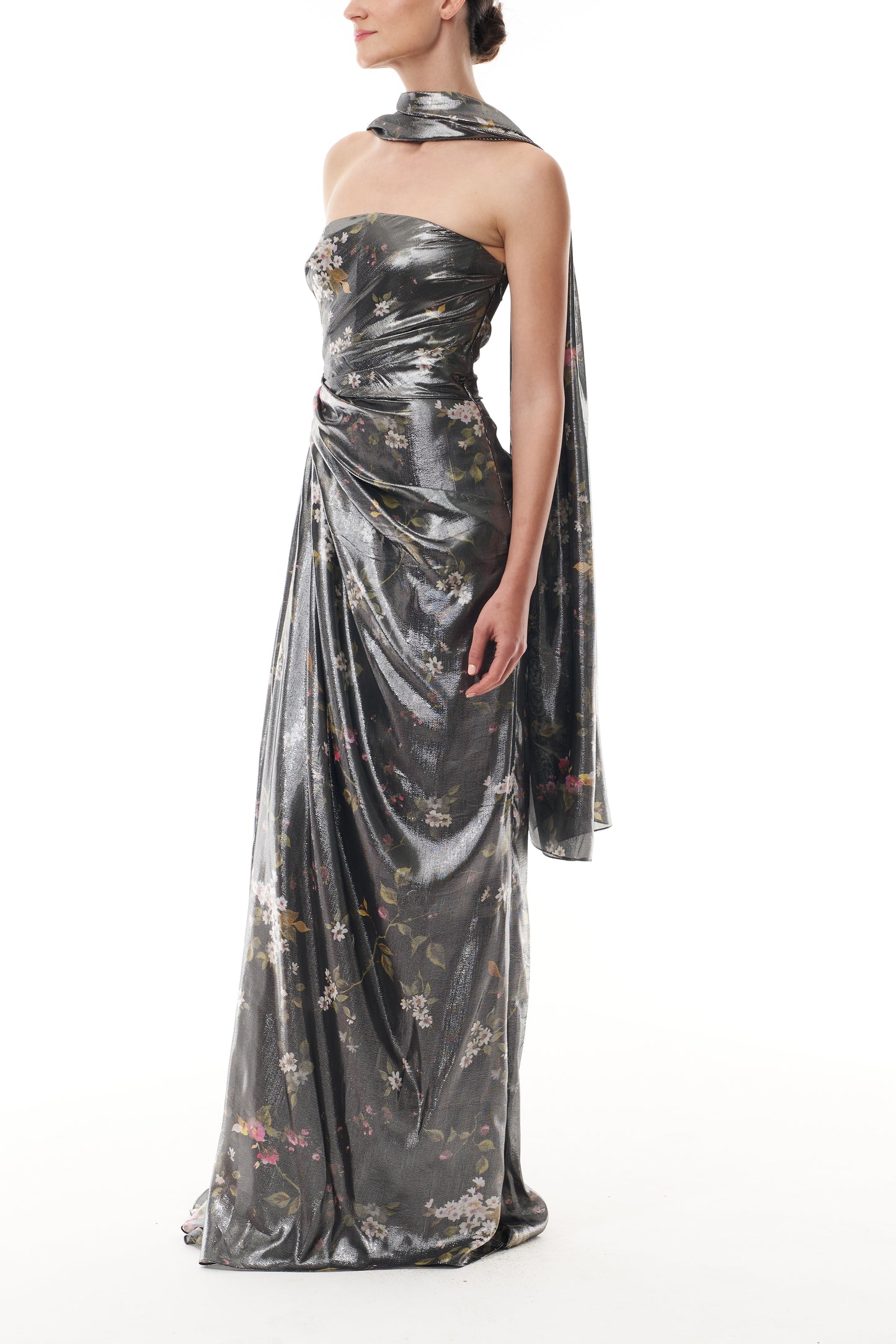 Monique Lhuillier Fall 2025 strapless gown with detached neck scarf in metallic floral printed lame fabric - side.