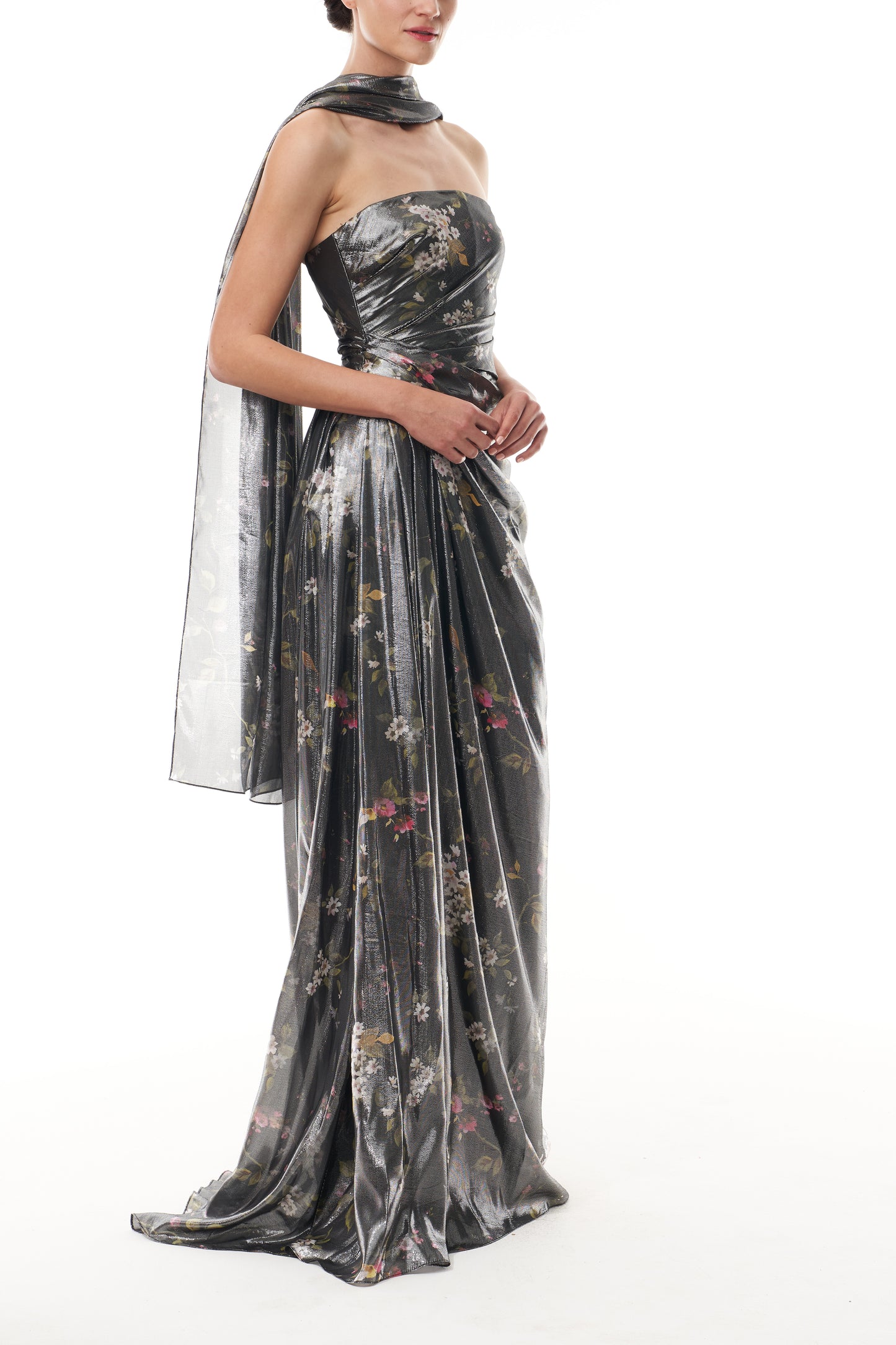 Monique Lhuillier Fall 2025 strapless gown with detached neck scarf in metallic floral printed lame fabric - side.