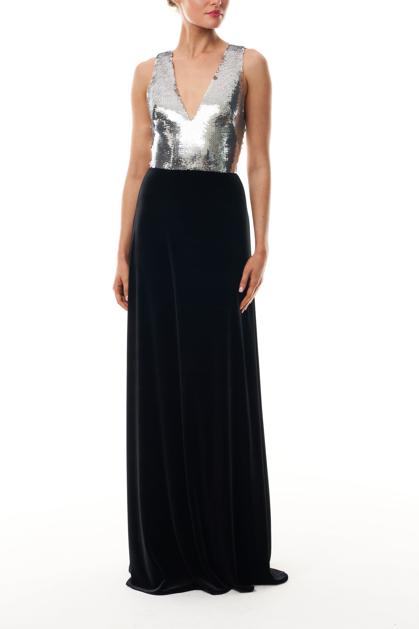 Monique Lhuillier Fall 2025 v-neck gown with silver sequin bodice and noir velvet skirt - front.